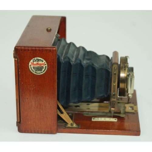 558 - A J. LIZARS 'CHALLENGE' QUARTER PLATE TROPICAL HAND & STAND CAMERAwith J Lizars circular plaque,... 