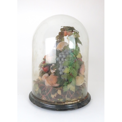 562 - A VICTORIAN WAX DISPLAY OF FRUITon circular base with domed glass case, (af), 50cm high... 