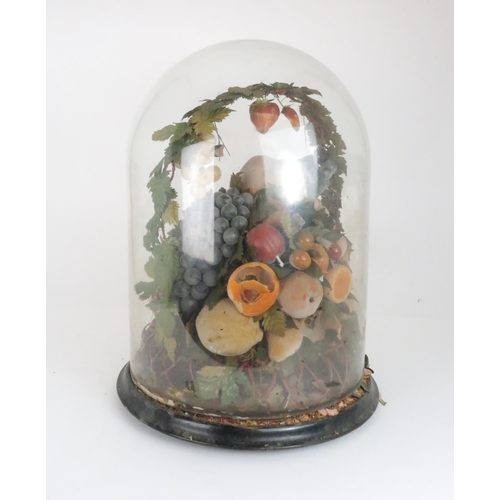 562 - A VICTORIAN WAX DISPLAY OF FRUITon circular base with domed glass case, (af), 50cm high... 