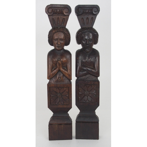 567 - A PAIR OF CARVED OAK FIGURAL PANELSdepicting a male and female, the male with arms crossed, 51cm hig... 