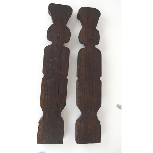 567 - A PAIR OF CARVED OAK FIGURAL PANELSdepicting a male and female, the male with arms crossed, 51cm hig... 