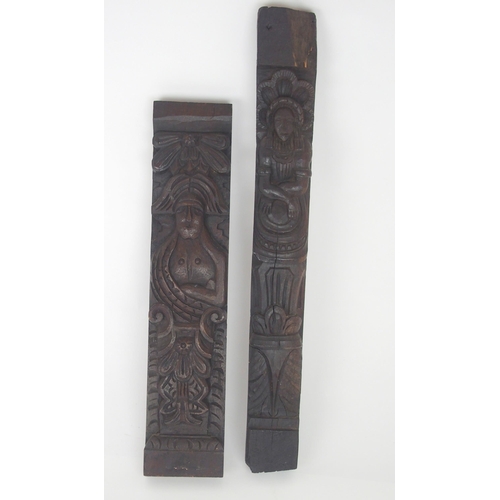 568 - A CARVED OAK PANEL OF A MANand another of a lady, 53cm and 64cm high (2)