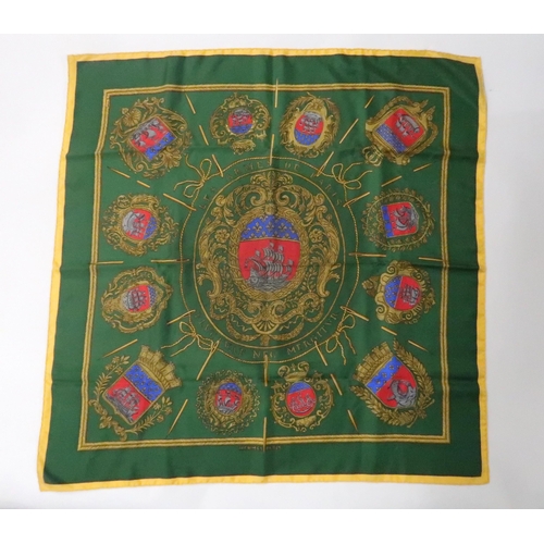 569 - HERMES VINTAGE LES ARMES DE PARIS SILK SCARFon green ground, 88 x 88cm, a Decoupages Hermes scarf by... 