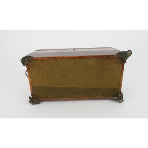 573 - A REGENCY TWO DIVISION TEA CADDYwith hinged lid and  with burr walnut lidded compartments with mixin... 