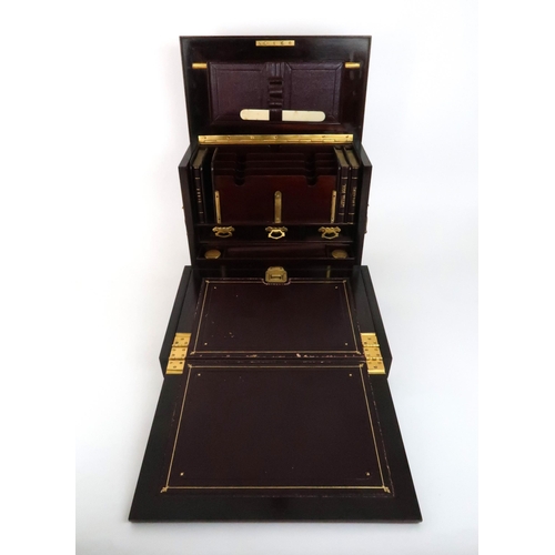 575 - A VICTORIAN INLAID ROSEWOOD STATIONARY BOXthe exterior inlaid with an urn and scrolling foliage the ... 