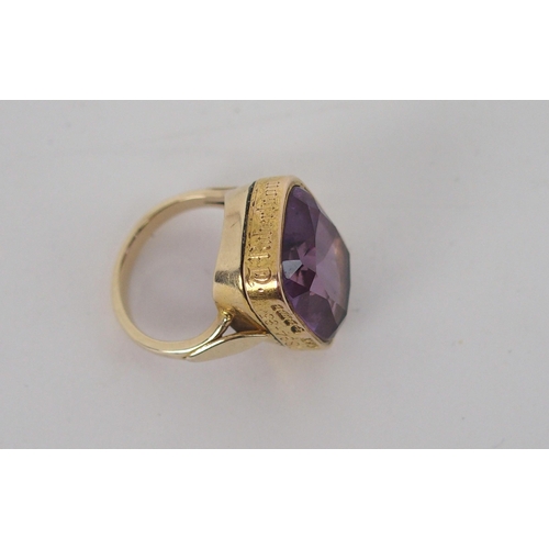 593 - *WITHDRAWN*A 15ct GOLD AND AMETHYST GENTS RINGconverted from watch fob, the side of the ring inscrib... 