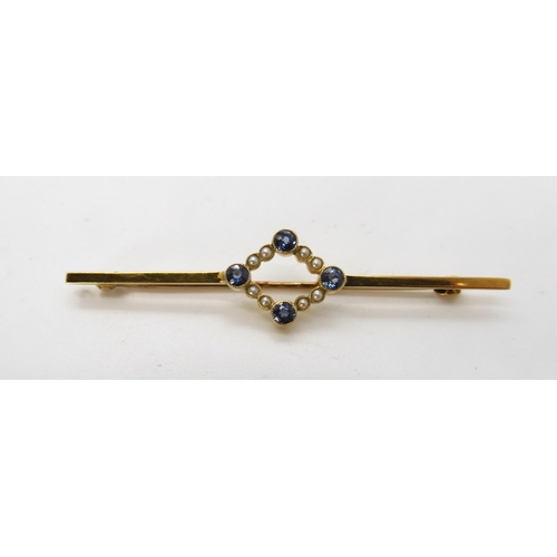 701 - A 15CT GOLD SAPPHIRE AND PEARL BAR BROOCH in original Harrod's box, length 6cm, sapphires approx 3mm... 