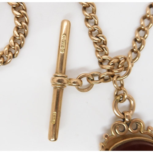 703 - A 9CT GOLD FOB CHAIN with an attached carnelian swivel fob seal, length to include both lobster claw... 