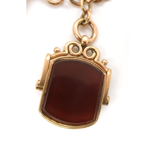 703 - A 9CT GOLD FOB CHAIN with an attached carnelian swivel fob seal, length to include both lobster claw... 