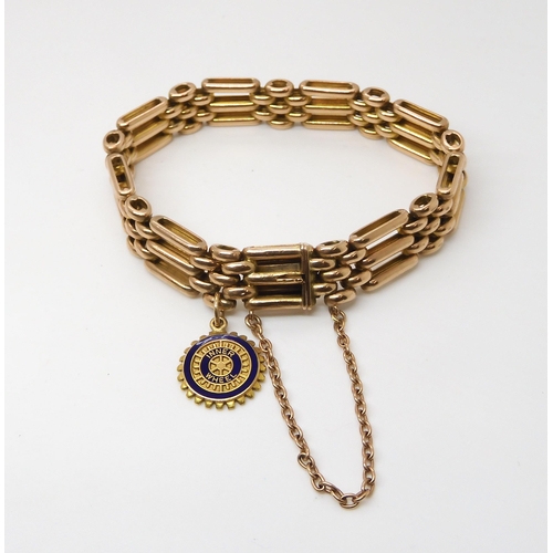 709 - A 9CT ROSE GOLD FANCY LINK BRACELET with box clasp and 9ct gold and enamel 'The Rotary Club' Inner W... 