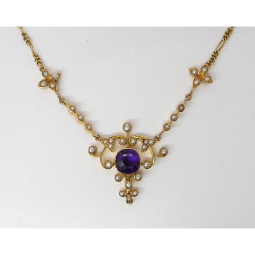 715 - A PEARL AND AMETHYST EDWARDIAN PENDANT NECKLACE made in bright yellow metal with a figaro chain to a... 