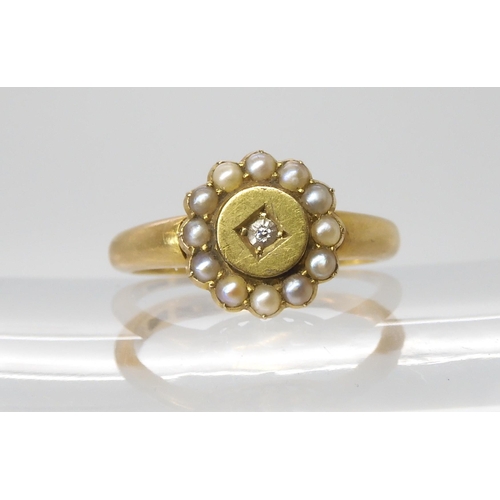 719 - TWO VINTAGE RINGS an 18ct gold pearl and diamond cluster ring, made by Barnet Henry Joseph & Co.... 