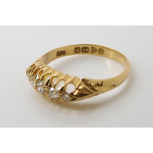 721 - AN 18CT GOLD FIVE STONE DIAMOND RING in classic scroll mount, with full Chester hallmarks for 1904, ... 