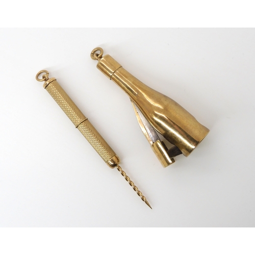 724 - TWO 9CT CIGAR ACCOUTREMENTS a bottle shaped cigar cutter, made by SJ Rose & Son hallmarked Londo... 