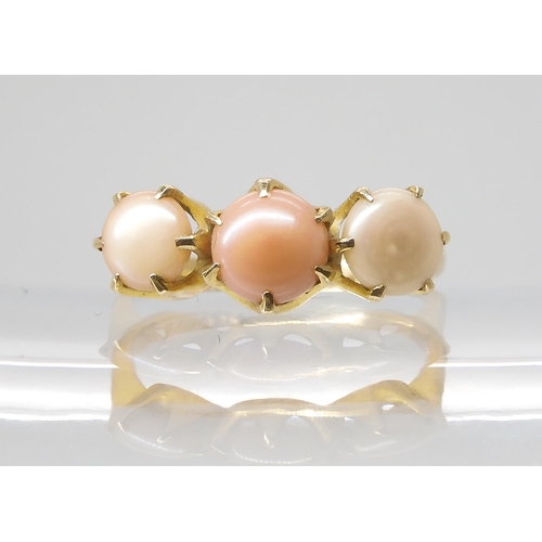 794 - A SCOTTISH RIVER PEARL RINGthe three button pearls in shades of pink are set into a classic crown mo... 