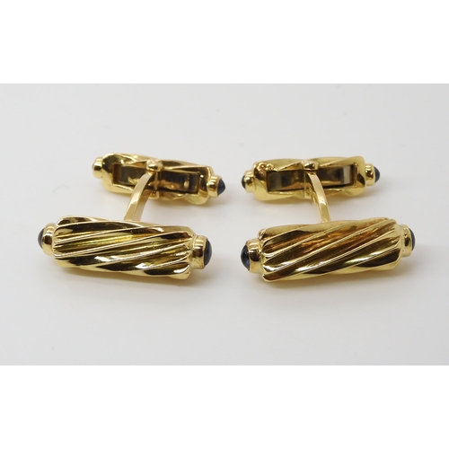 795 - A PAIR OF 18CT GOLD AND SAPPHIRE CUFFLINKSmade by Deakin & Francis, the fluted batons, both ends... 