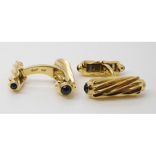 795 - A PAIR OF 18CT GOLD AND SAPPHIRE CUFFLINKSmade by Deakin & Francis, the fluted batons, both ends... 