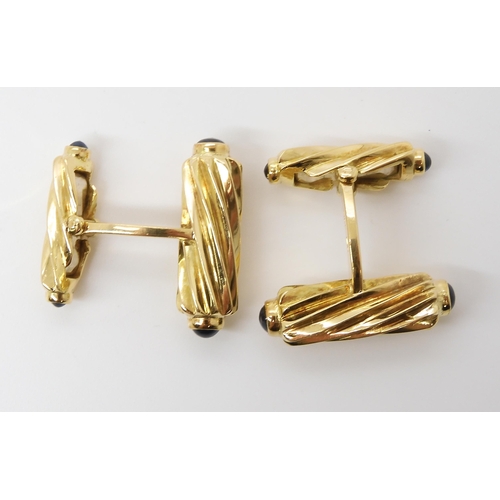 795 - A PAIR OF 18CT GOLD AND SAPPHIRE CUFFLINKSmade by Deakin & Francis, the fluted batons, both ends... 