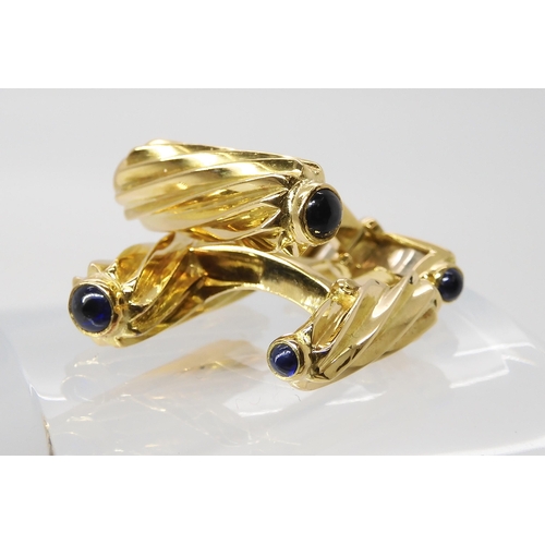 795 - A PAIR OF 18CT GOLD AND SAPPHIRE CUFFLINKSmade by Deakin & Francis, the fluted batons, both ends... 