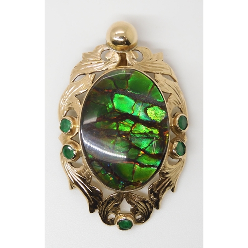 799 - A YELLOW METAL AMMOLITE AND EMERALD PENDANTsigned by goldsmith C. Noir, inscribed 14k. Set with an a... 