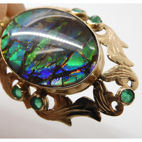 799 - A YELLOW METAL AMMOLITE AND EMERALD PENDANTsigned by goldsmith C. Noir, inscribed 14k. Set with an a... 