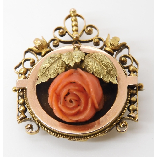 810 - AN ART NOUVEAU PENDANT BROOCHset with a carved coral rose, dimensions 3.6cm x 2.8cm, weight 7.4gms... 