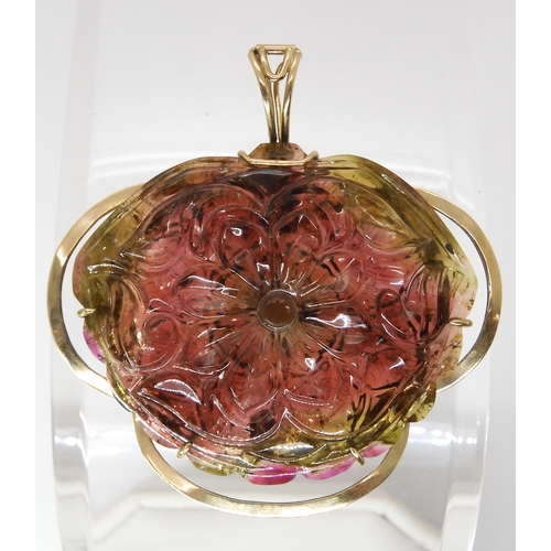 811 - A WATERMELON TOURMALINE PENDANTcarved on both sides as a flower, with 14k gold pendant clip mount, s... 