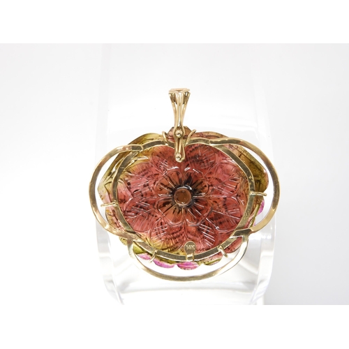 811 - A WATERMELON TOURMALINE PENDANTcarved on both sides as a flower, with 14k gold pendant clip mount, s... 