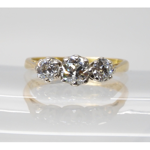 813 - AN 18CT GOLD THREE STONE DIAMOND RINGset with estimated approx 1ct of old cut diamonds, in classic c... 