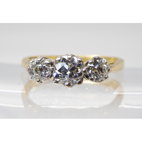 813 - AN 18CT GOLD THREE STONE DIAMOND RINGset with estimated approx 1ct of old cut diamonds, in classic c... 