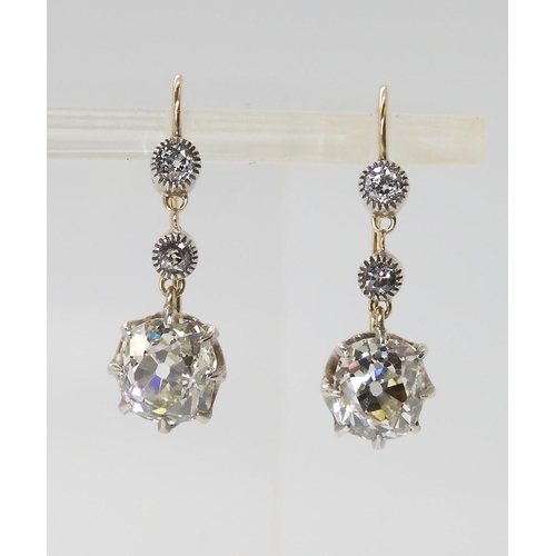 815 - A PAIR OF CUSHION CUT DIAMOND DROP EARRINGSmounted in yellow and white gold classic crown settings, ... 