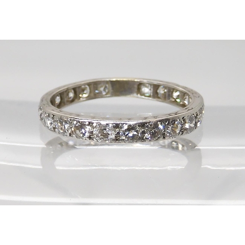 817 - A FULL DIAMOND ETERNITY RINGgrain set in white metal. set with estimated approx 0.88cts of brilliant... 