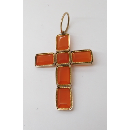 820 - A CARNELIAN CROSSmade from separate facet cut carnelians in vibrant orange mounted in yellow metal. ... 