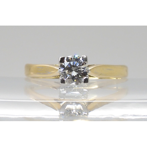 821 - A SOLITAIRE DIAMOND RINGset with an estimated approx 0.48ct brilliant cut diamond in a four claw set... 