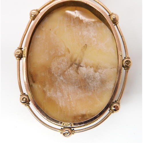 822 - A LARGE 9CT GOLD MOUNTED CAMEO PENDANT & PEARLSthe baroque pearls are approximately 7.4mm each, ... 