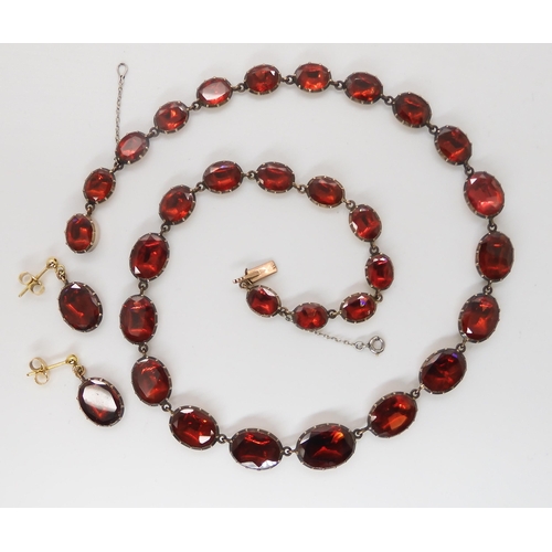 823 - AN ANTIQUE FOILED BACK GARNET PARUREcomprising of a necklace the garnets in  yellow metal cut b... 