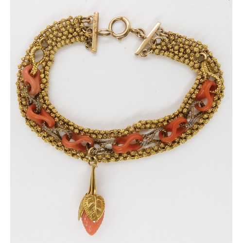 825 - A THREE STRAND CARVED CORAL BRACELEThung with a carved coral strawberry with coral links very simila... 