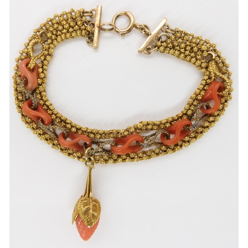 825 - A THREE STRAND CARVED CORAL BRACELEThung with a carved coral strawberry with coral links very simila... 