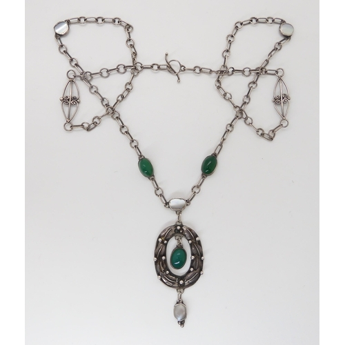 826 - AN ARTS & CRAFTS NECKLACEhandmade from white metal and set with chrysoprase and mother of pearl.... 