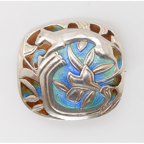 830 - A NORWEGIAN ENAMELLED BROOCH BY JACOB TOSTRUPa stylised cat amongst foliage, enamelled in blue green... 