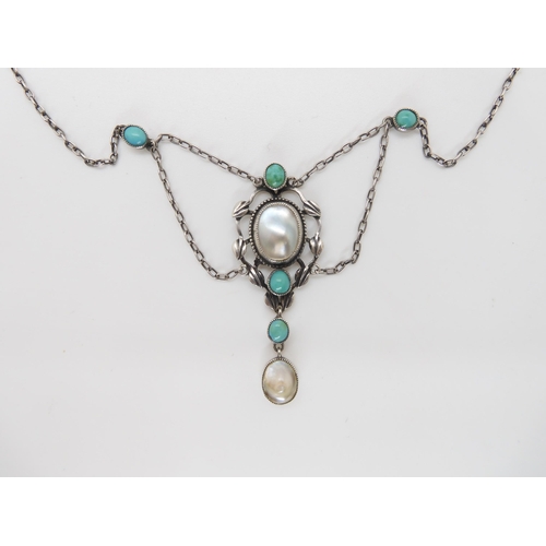 831 - AN ARTS & CRAFTS NECKLACEset with turquoise and blister pearls, in the manner of Jessie M King f... 