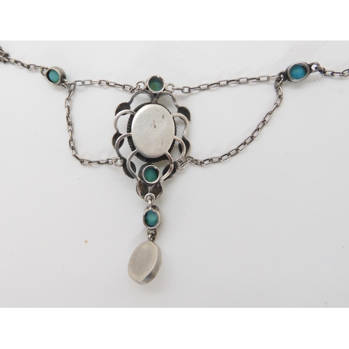 831 - AN ARTS & CRAFTS NECKLACEset with turquoise and blister pearls, in the manner of Jessie M King f... 