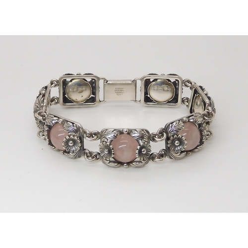 832 - A DANISH SILVER BRACELET BY  N.E. FROMset with rose quartz cabochons amid the silver flowers an... 