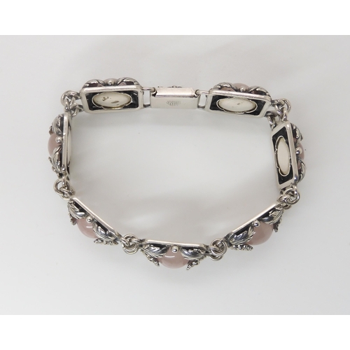 832 - A DANISH SILVER BRACELET BY  N.E. FROMset with rose quartz cabochons amid the silver flowers an... 