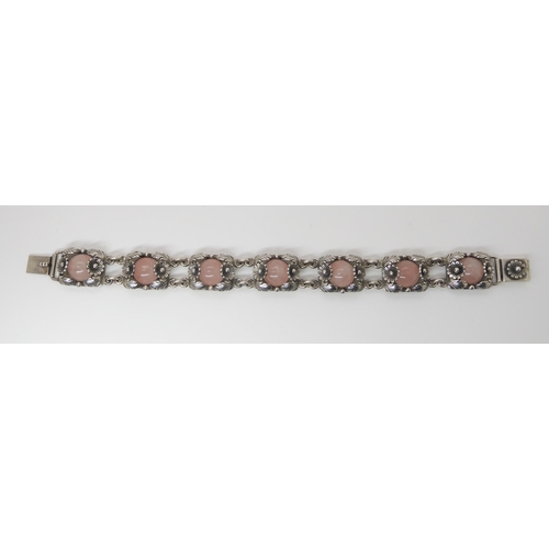 832 - A DANISH SILVER BRACELET BY  N.E. FROMset with rose quartz cabochons amid the silver flowers an... 