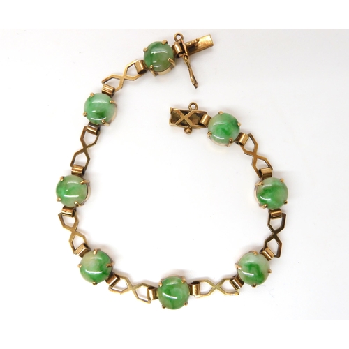 835 - A 9CT GOLD CHINESE GREEN HARDSTONE BRACELETthe hardstones measure 8.3mm approx each with decorative ... 