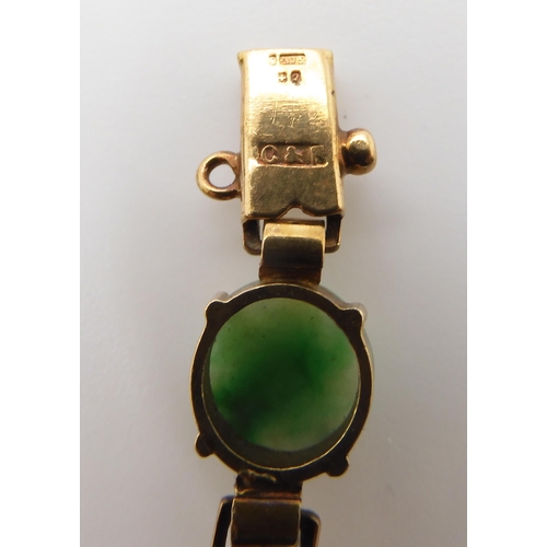 835 - A 9CT GOLD CHINESE GREEN HARDSTONE BRACELETthe hardstones measure 8.3mm approx each with decorative ... 