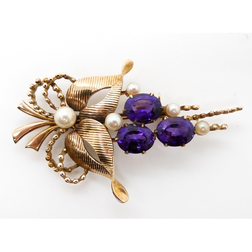 838 - A 9CT AMETHYST AND PEARL FLORAL BROOCHwith full Birmingham hallmarks for 1961. Dimensions 6cm x 3.2c... 