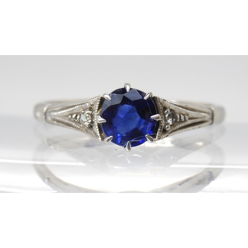 845 - A 9CT WHITE GOLD VINTAGE SAPPHIRE RINGset with a round sapphire measuring 5.3mm in diameter and 2.5m... 