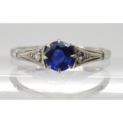 845 - A 9CT WHITE GOLD VINTAGE SAPPHIRE RINGset with a round sapphire measuring 5.3mm in diameter and 2.5m... 
